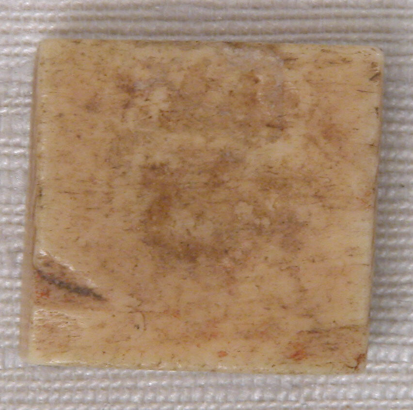 Counter, Bone; carved and incised