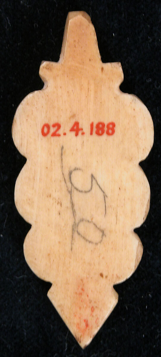 Amulet, Bone; incised and inlaid with paint