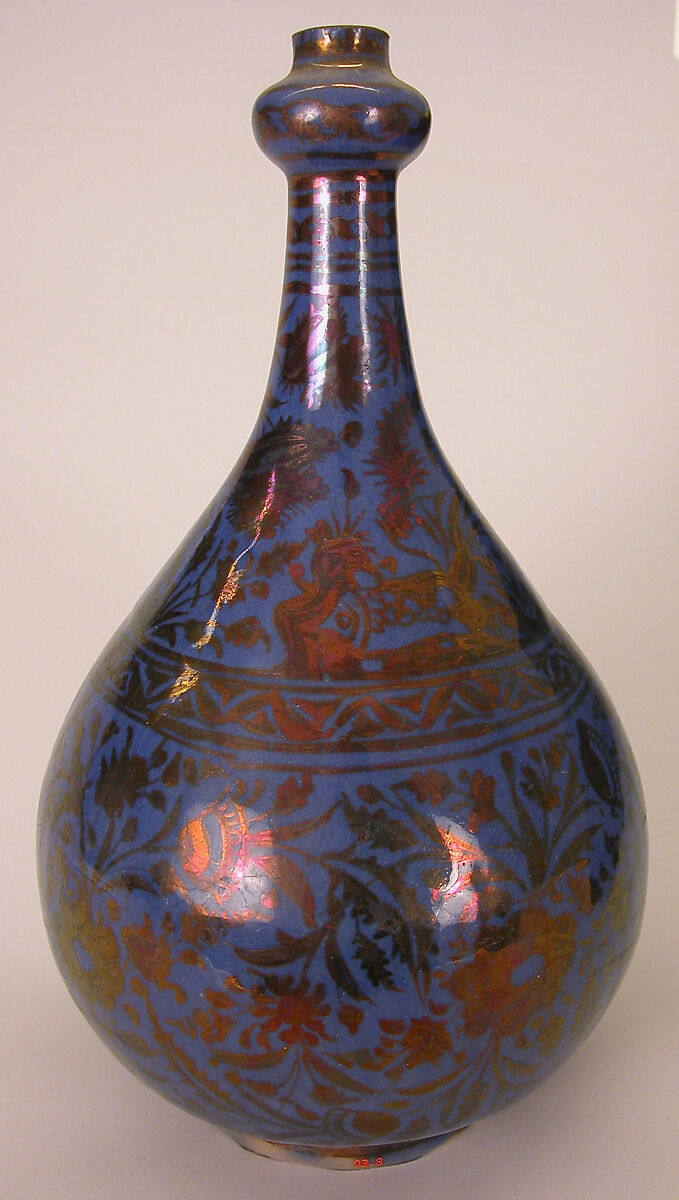 Bottle, Stonepaste; luster-painted on opaque blue glaze under transparent colorless glaze 