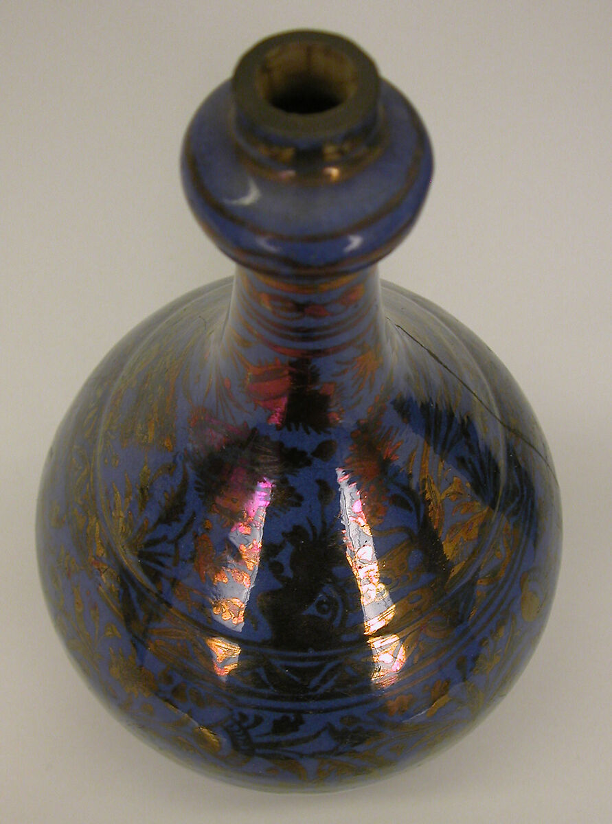 Bottle, Stonepaste; luster-painted on opaque blue glaze under transparent colorless glaze