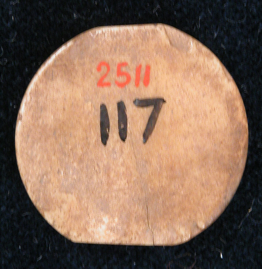 Disk, Bone; incised and inlaid with paint
Lead: stamped