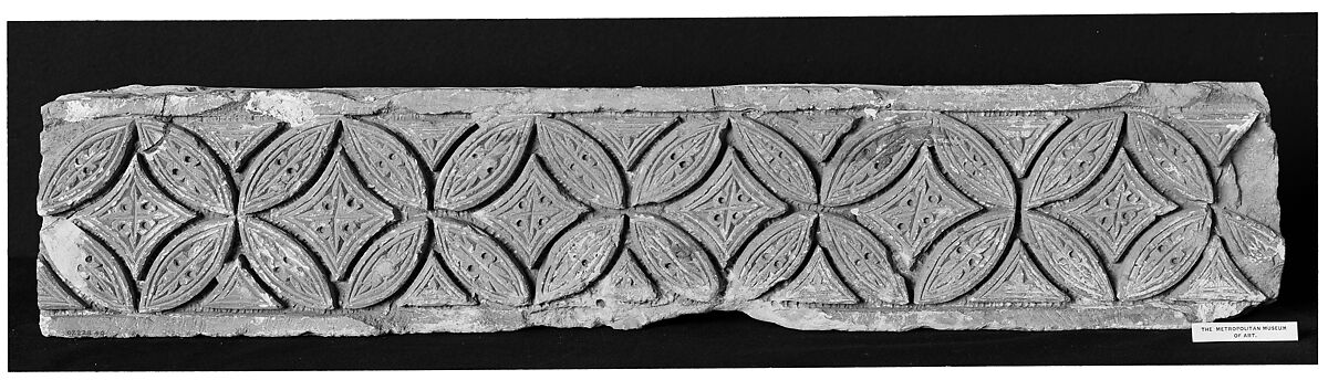 Fragment from a Post or Lintel with Leaves Branching from a Running Vine, Limestone; carved in relief 