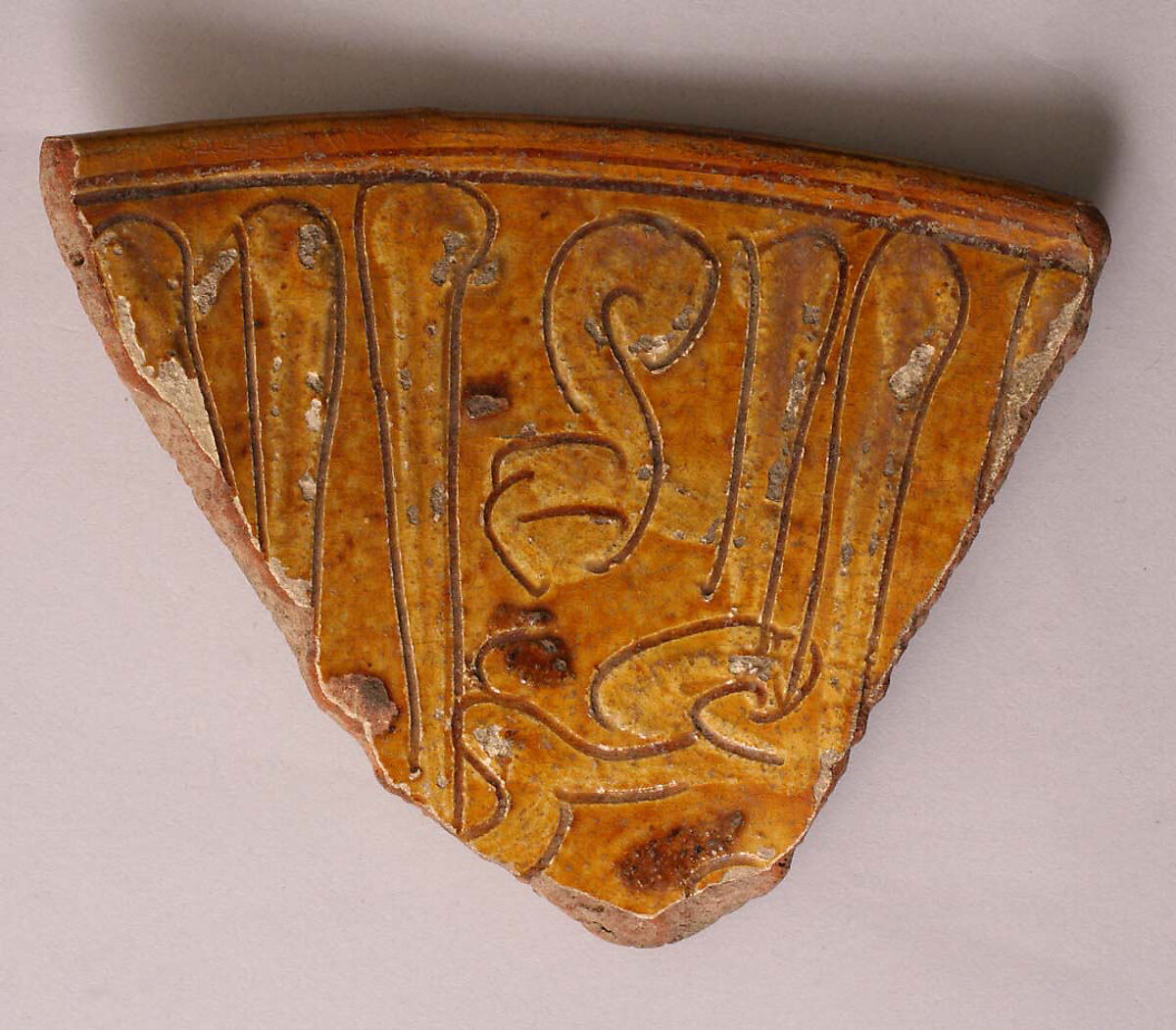 Fragment, Earthenware; incised decoration through a white slip and coloring under  transparent glaze 