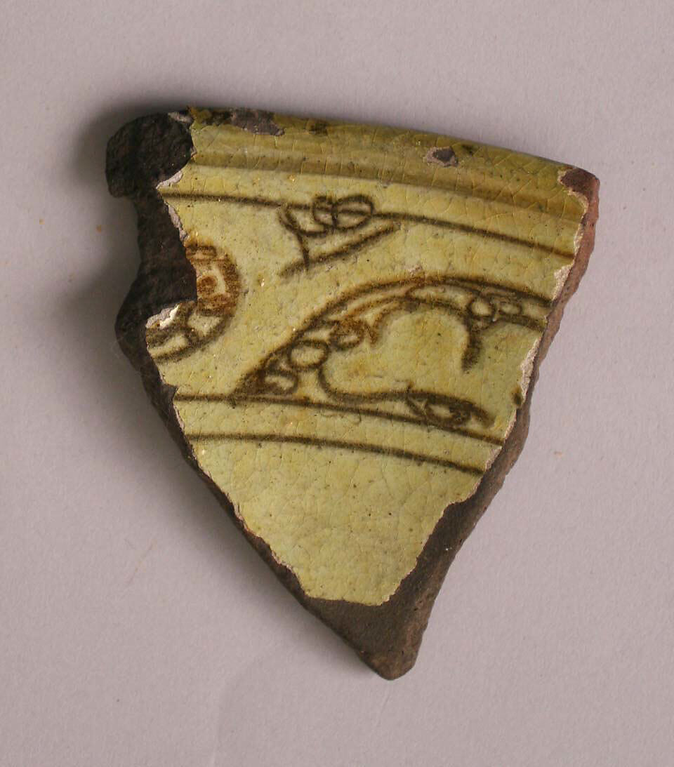 Fragment, Earthenware; incised decoration through a white slip and coloring under transparent glaze 