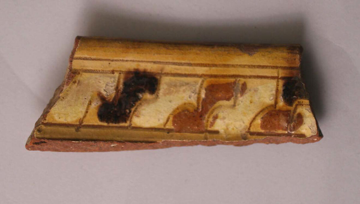 Fragment, Earthenware; incised decoration through a white slip and coloring under transparent glaze. 