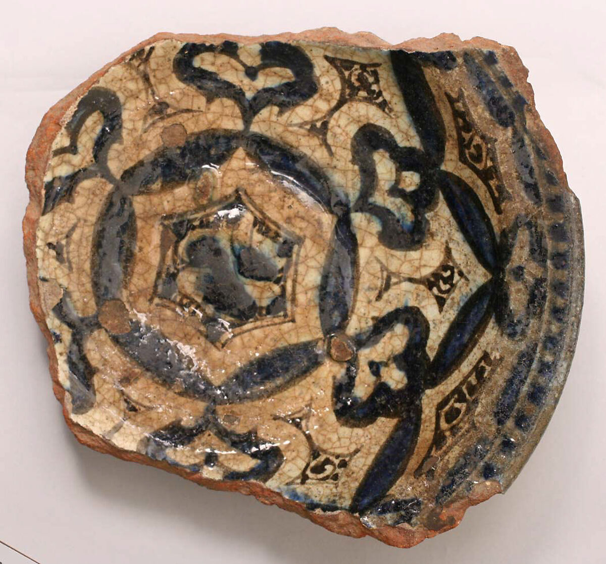 Fragment of a Bowl, Earthenware; underglaze black and blue on white slip; transparent colorless glaze 