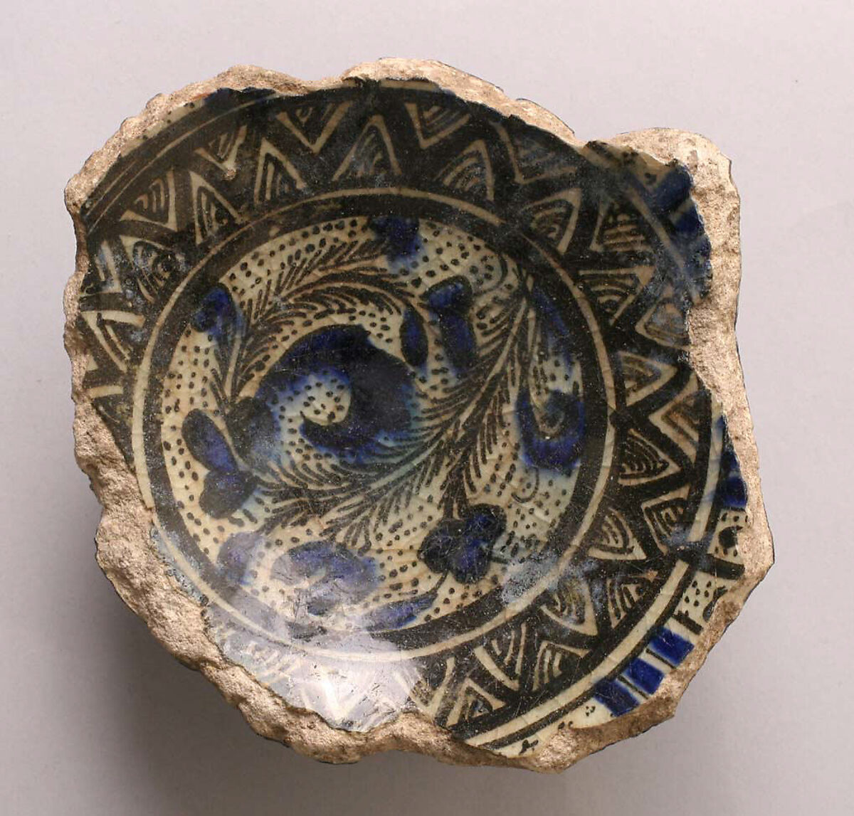 Fragment of a Bowl, Stonepaste; underglaze blue and black; transparent, colorless glaze 