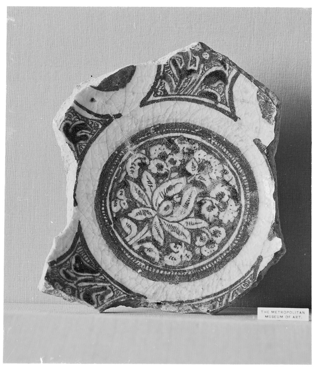 Fragment of a Bowl, Stonepaste; underglaze blue and black; transparent, colorless glaze
