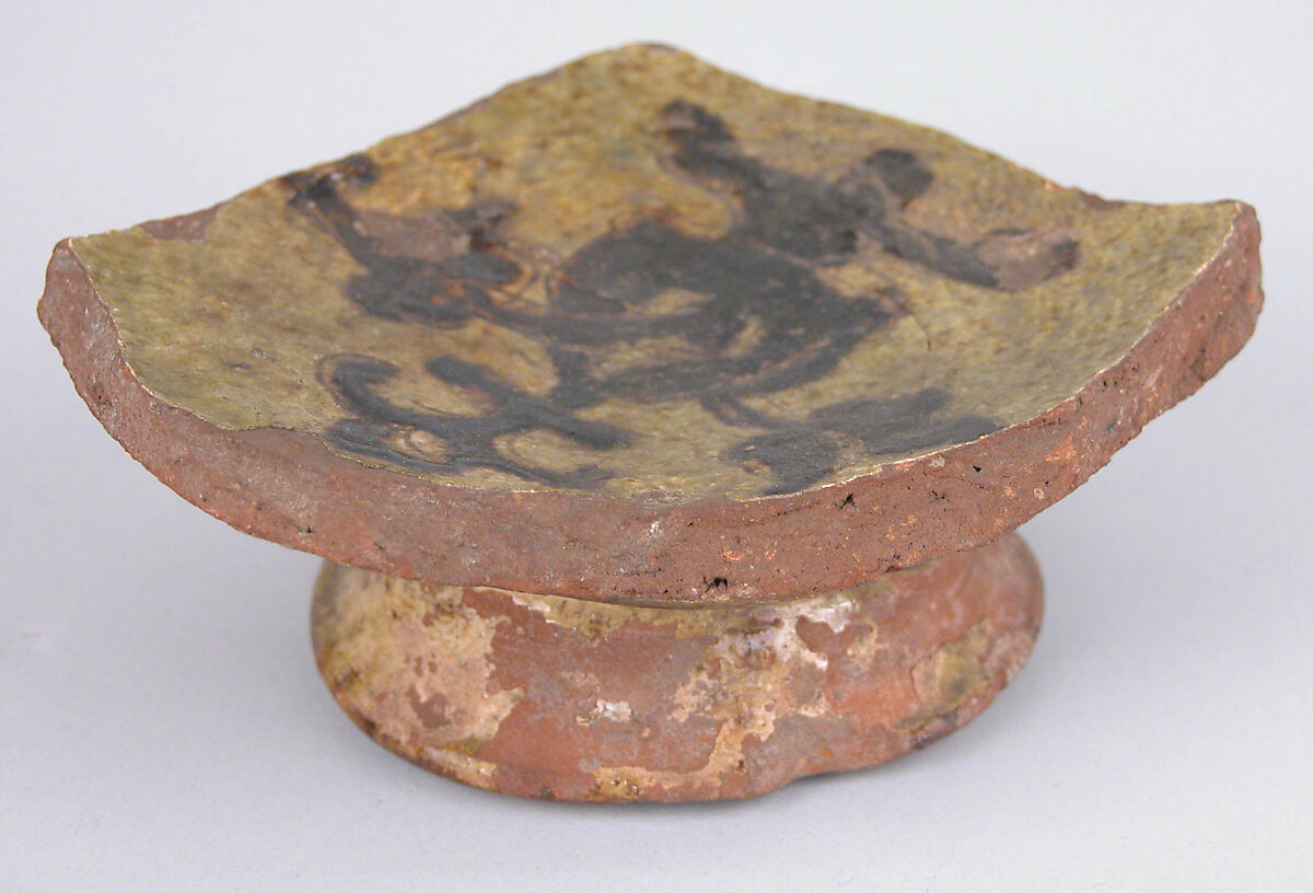 Fragment of a Bowl, Earthenware; incised decoration through a white slip and coloring under transparent glaze 