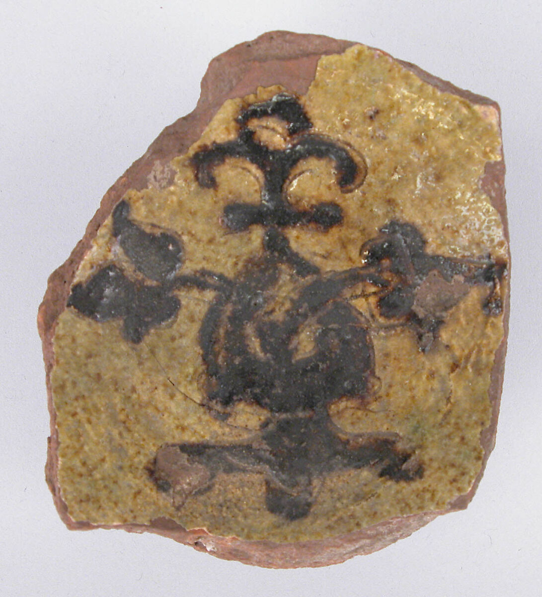 Fragment of a Bowl, Earthenware; incised decoration through a white slip and coloring under transparent glaze