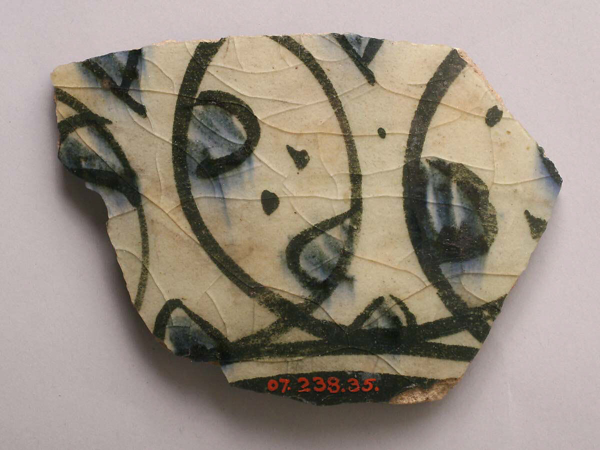 Fragment, Stonepaste; white slip; blue and black underglaze; transparent, colorless glaze 