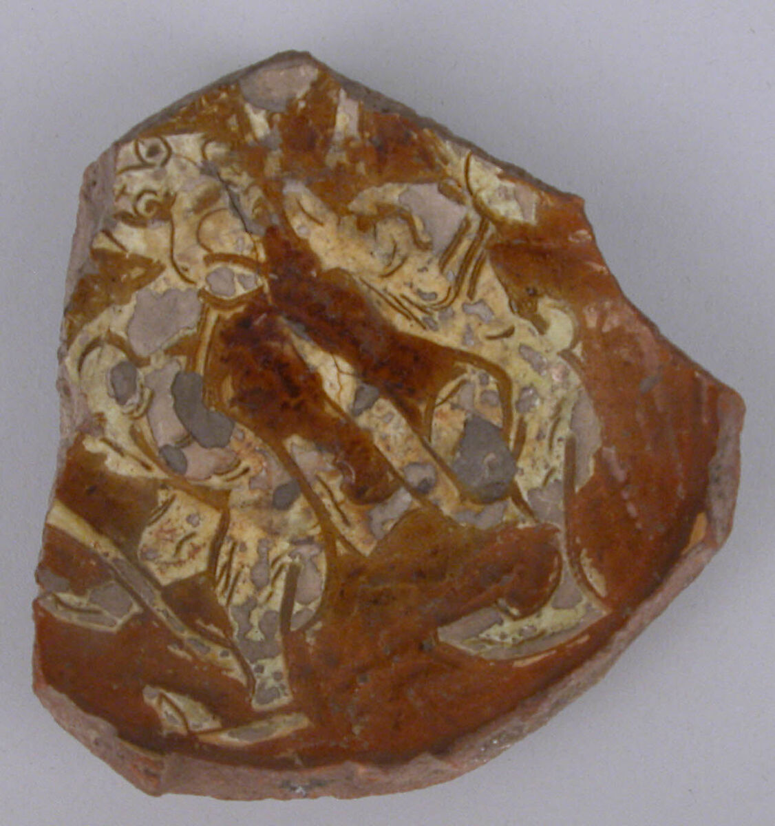 Fragment, Earthenware; incised decoration through a white slip and coloring under transparent glaze 