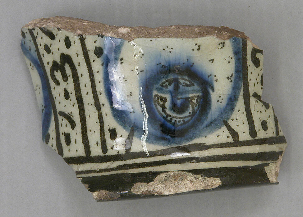 Ceramic Fragment, Stonepaste; white slip; blue and black underglaze; transparent, colorless glaze 
