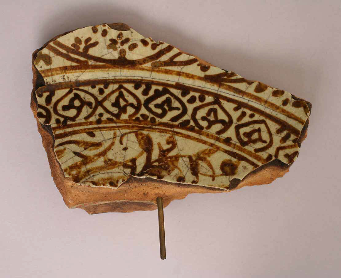 Fragment, Earthenware; incised decoration through a white slip and coloring under transparent glaze 