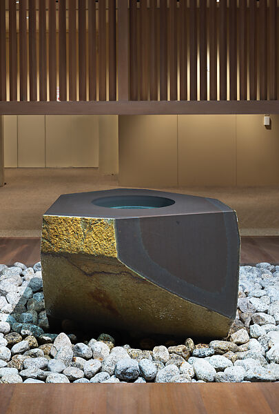 Water Stone, Isamu Noguchi (American, Los Angeles, California 1904–1988 New York), Basalt; on a foundation bed of naturally rounded granite stones, Japan/United States