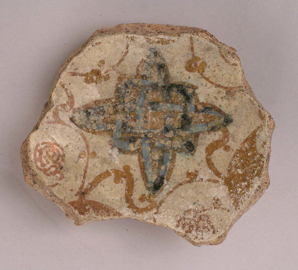 Fragment of a Bowl, Reddish earthenware; white slip; blue under transparent, colorless glaze; luster paint 
