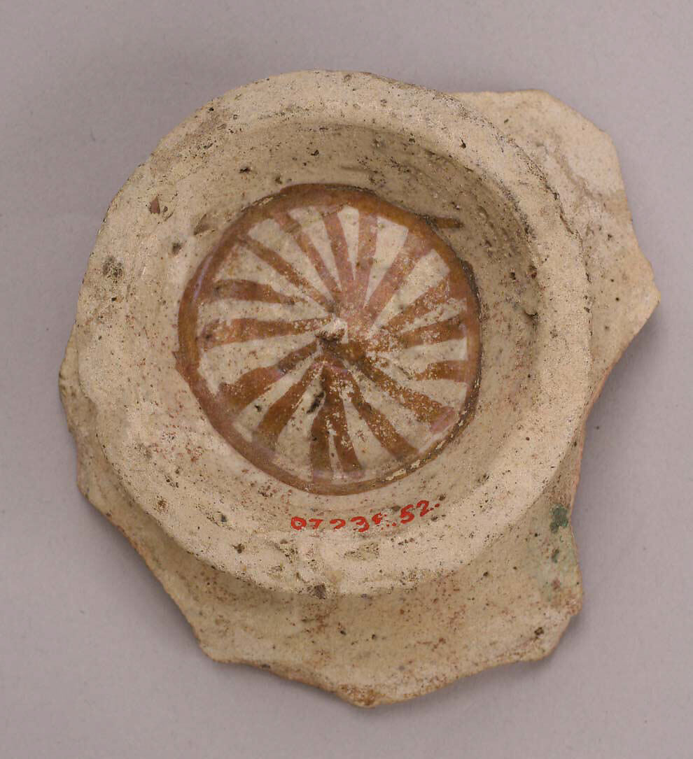Fragment of a Bowl, Reddish earthenware; white slip; blue under transparent, colorless glaze; luster paint