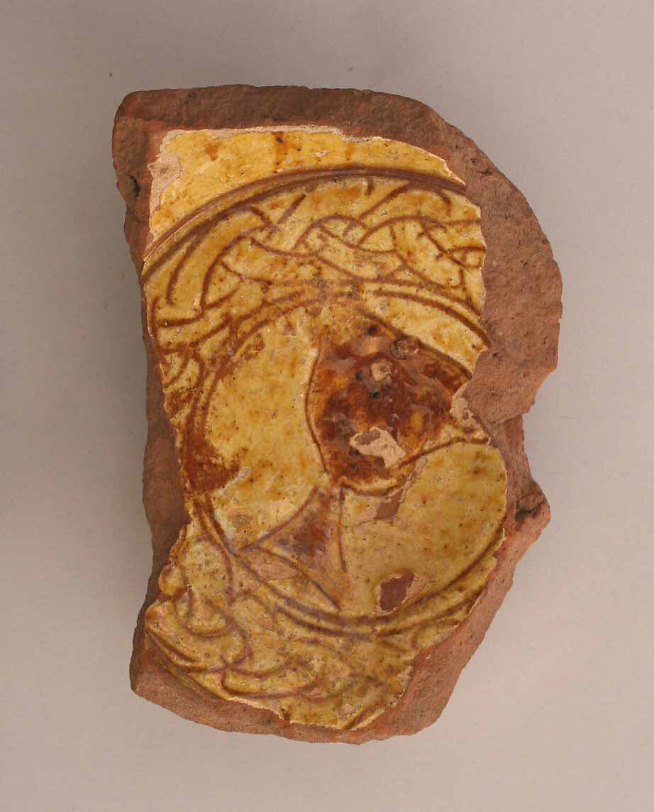 Fragment of a Bowl, Earthenware; incised decoration through a white slip and coloring under transparent glaze 