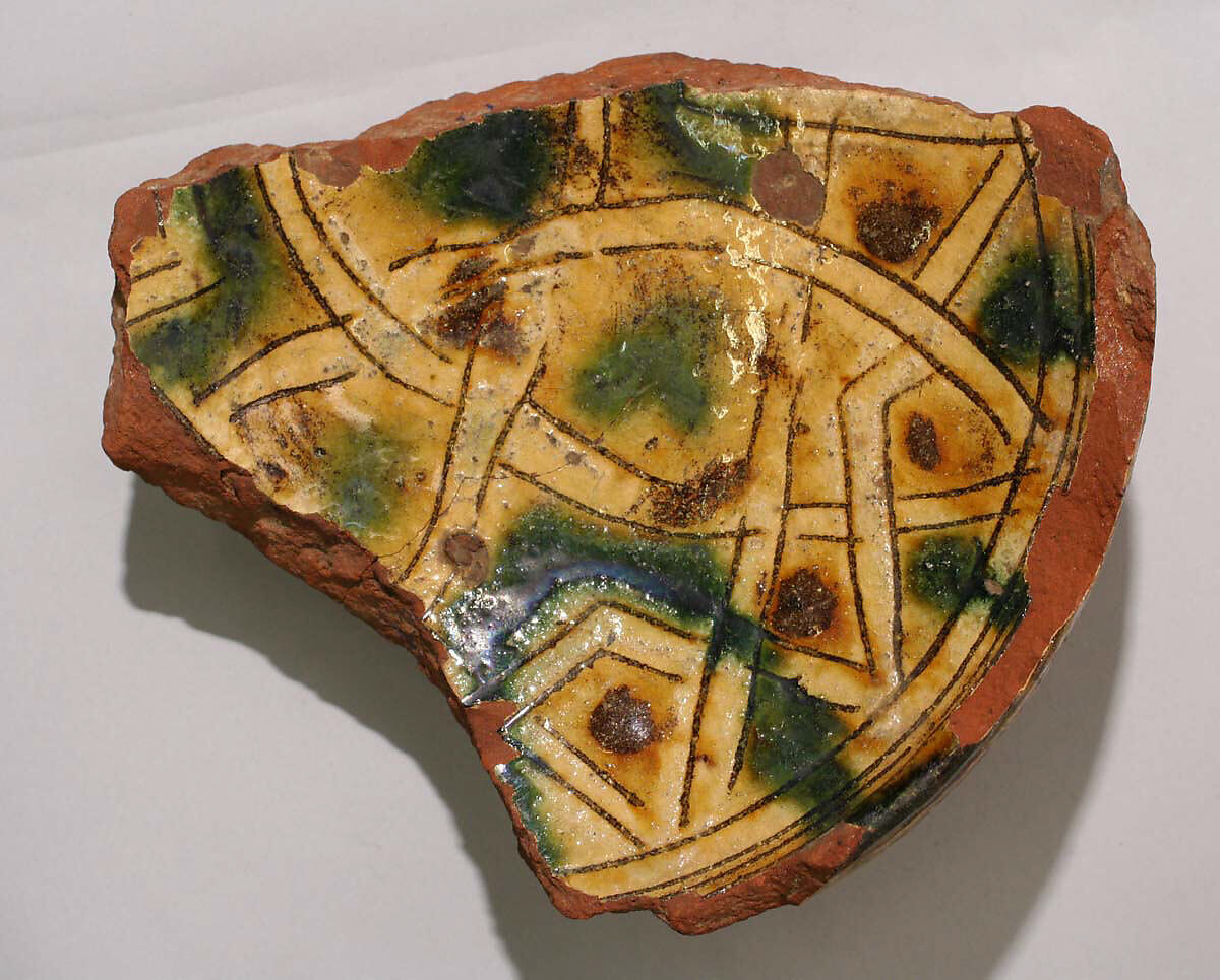 Fragment of a Plate, Earthenware; incised decoration through a white slip and coloring under transparent glaze 