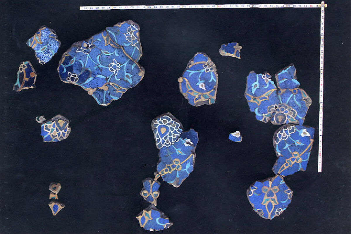 A Group of Mosaic Tilework Fragments, Stonepaste; polychrome glazed tiles, set into clay 
