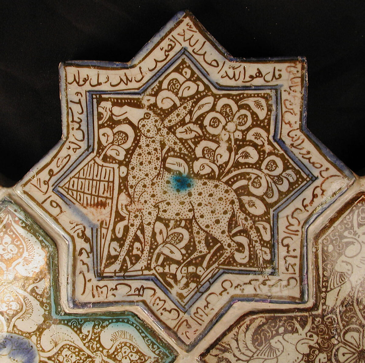 Star-Shaped Tile, Stonepaste; inglaze painted in blue and turquoise and luster-painted on opaque white glaze 