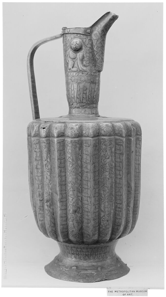 Ewer, Brass; fluted, engraved and repoussé, originally inlaid with silver