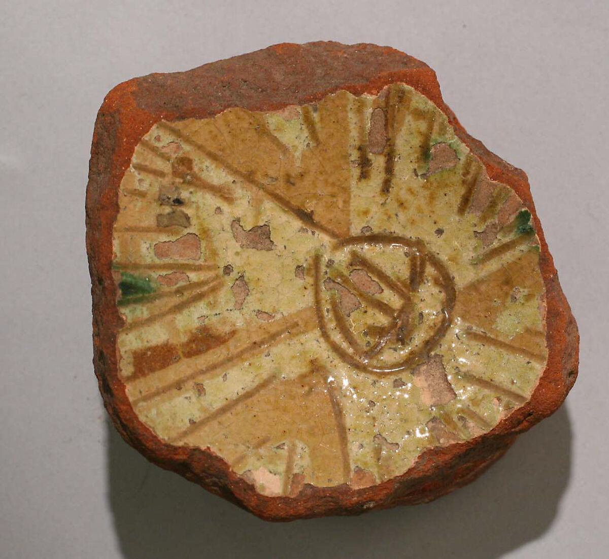 Fragment of a Bowl, Earthenware; incised decoration through a white slip and coloring under a transparent glaze. 