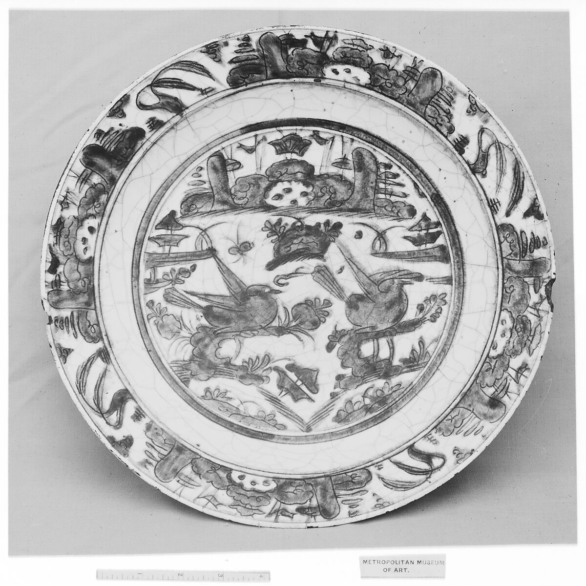 Dish, Stonepaste; underglaze blue; transparent, colorless glaze; unglazed base