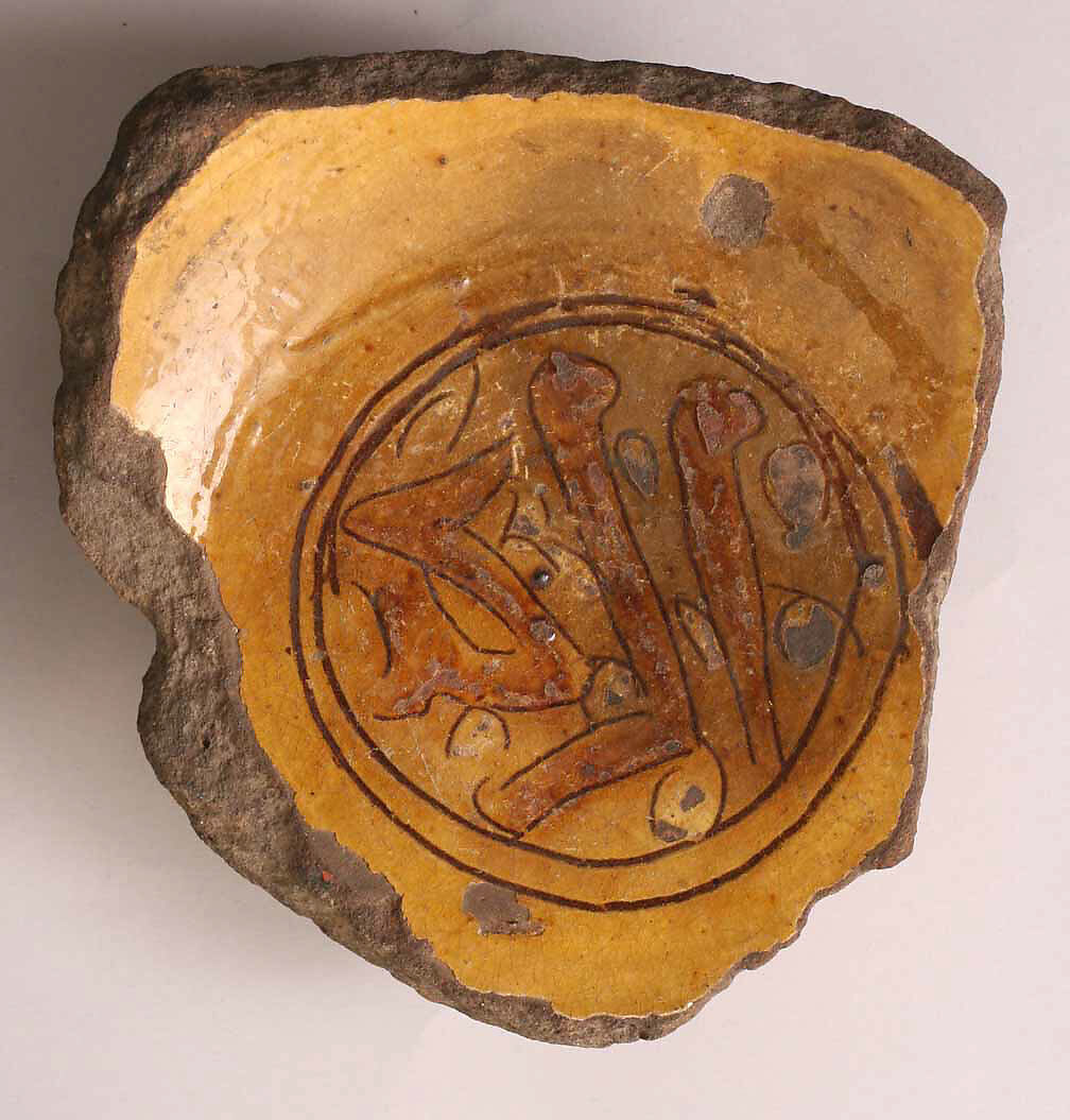 Fragment of a Bowl, Earthenware; incised decoration through white slip and coloring under transparent glaze 