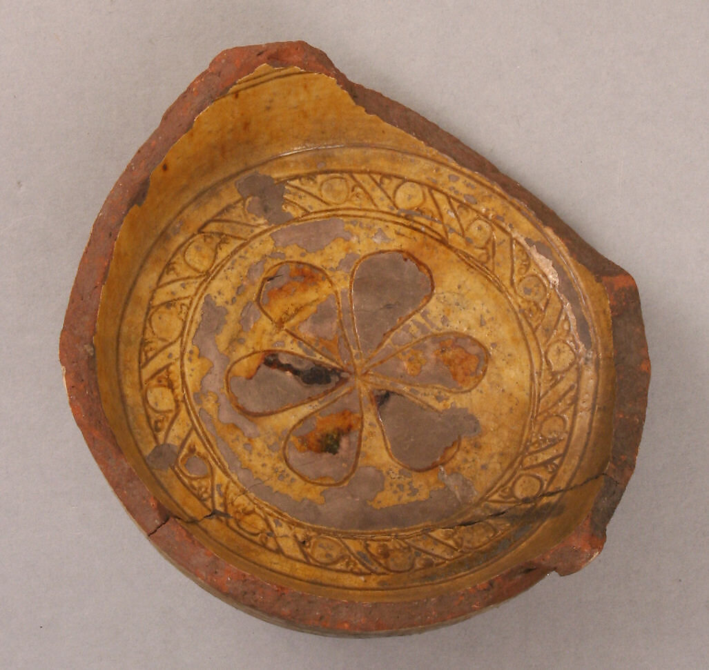 Fragment of a Bowl, Earthenware; incised decoration through white slip and coloring under transparent glaze 