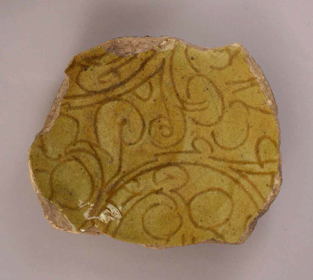 Ceramic Fragment, Earthenware; incised decoration under mustard yellow glaze 