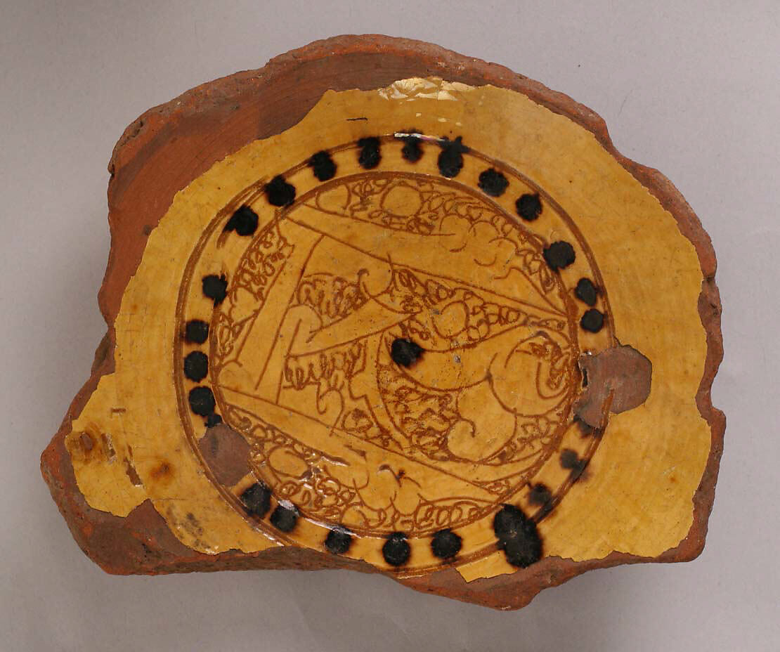 Fragment of a Bowl, Earthenware; incised decoration through white slip and coloring under transparent glaze 