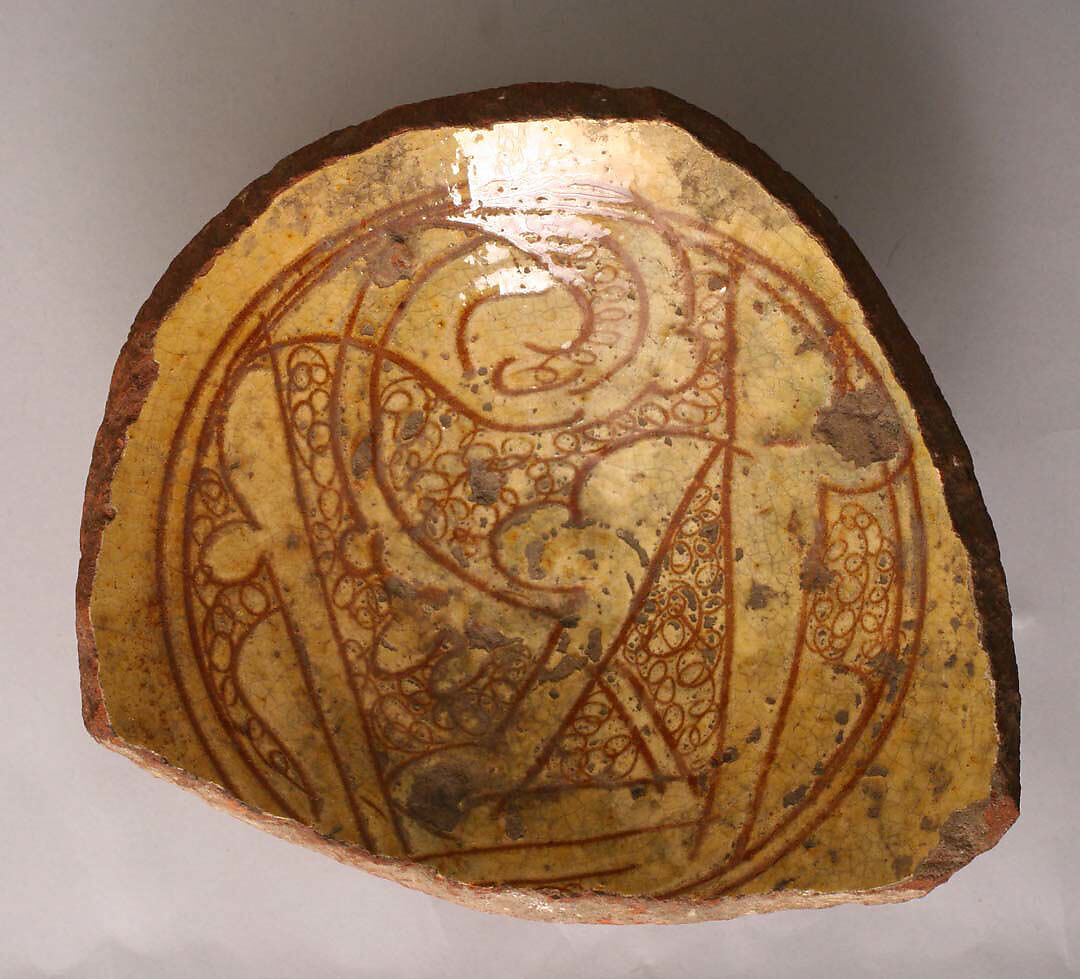 Fragment of a Bowl, Earthenware; incised decoration through white slip and coloring under transparent glaze 