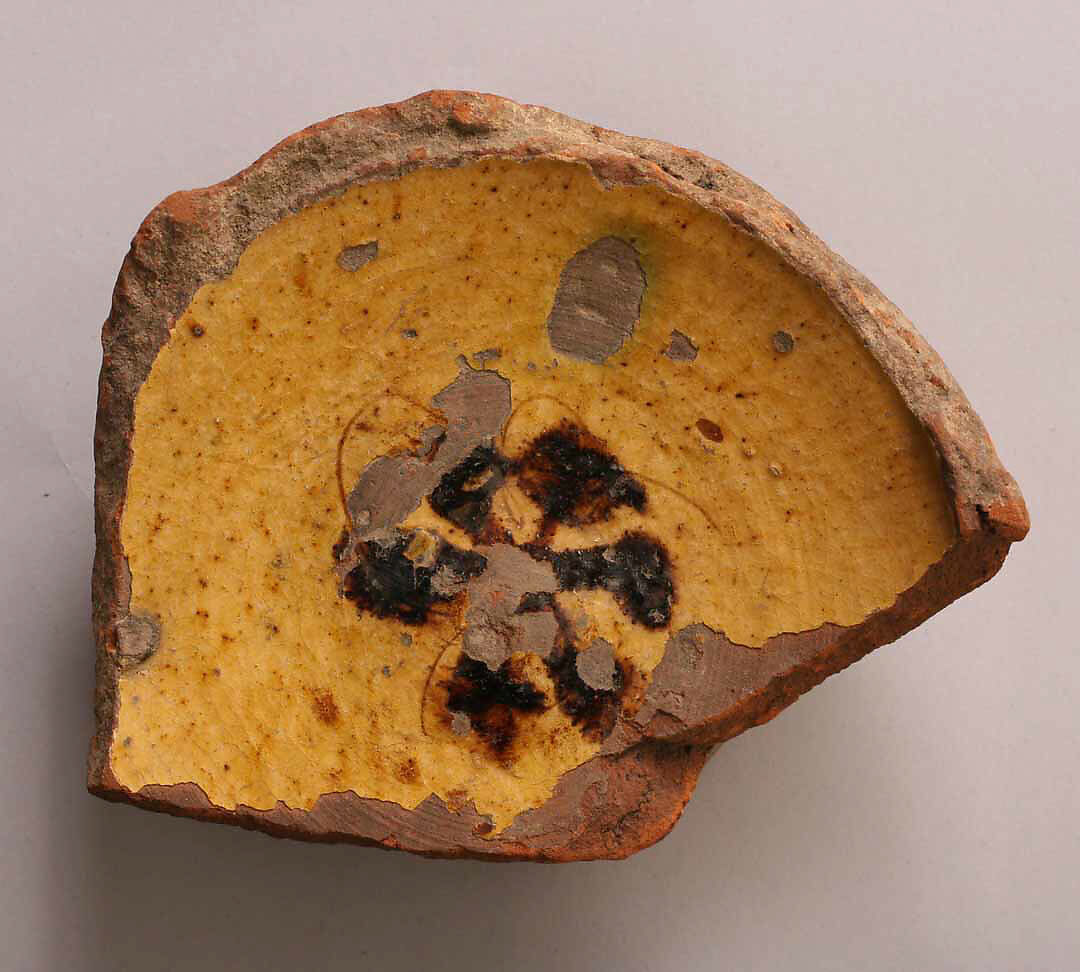 Fragment of a Bowl, Earthenware; incised decoration through white slip and coloring under transparent glaze 
