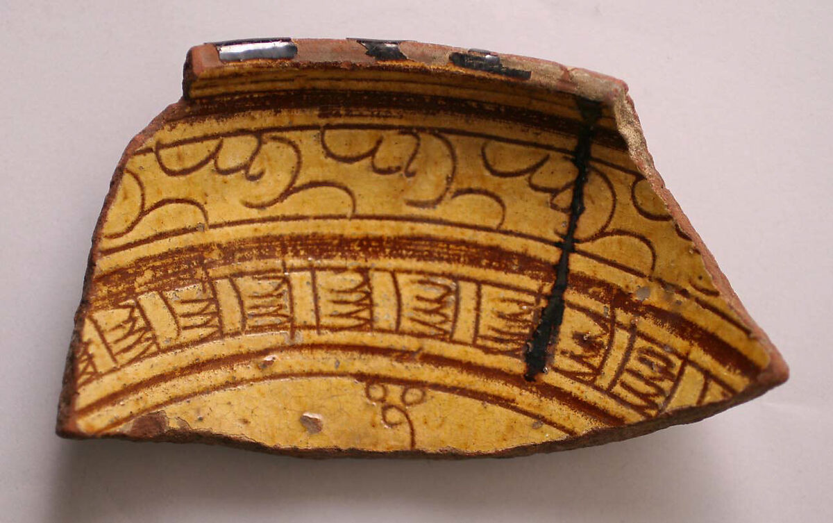 Fragment, Earthenware; incised decoration through white slip and coloring under transparent glaze 