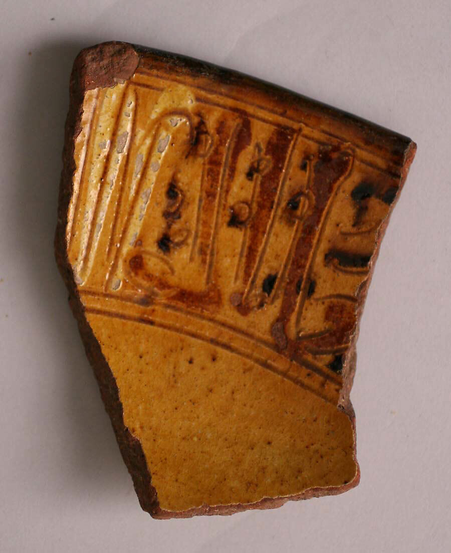 Fragment, Earthenware; incised decoration through white slip and coloring under transparent glaze 