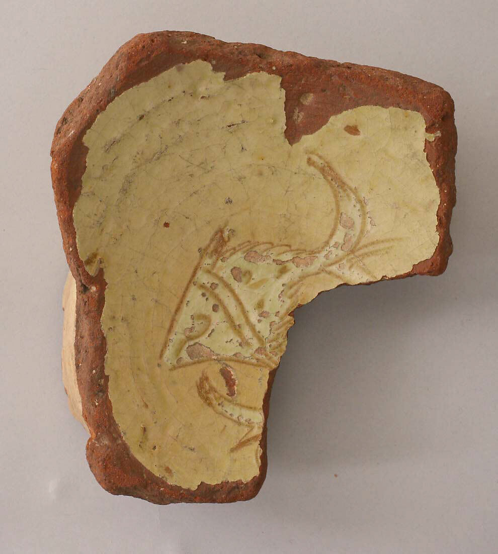 Fragment of a Bowl, Earthenware; incised decoration through white slip and coloring under transparent glaze 