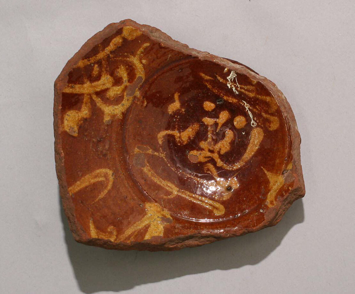 Fragment of a Bowl, Earthenware; slip-painted under transparent glaze 