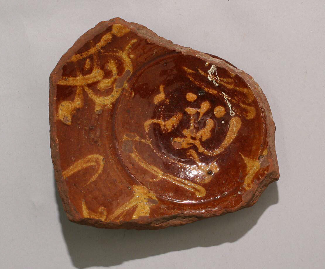 Fragment of a Bowl, Earthenware; slip-painted under transparent glaze