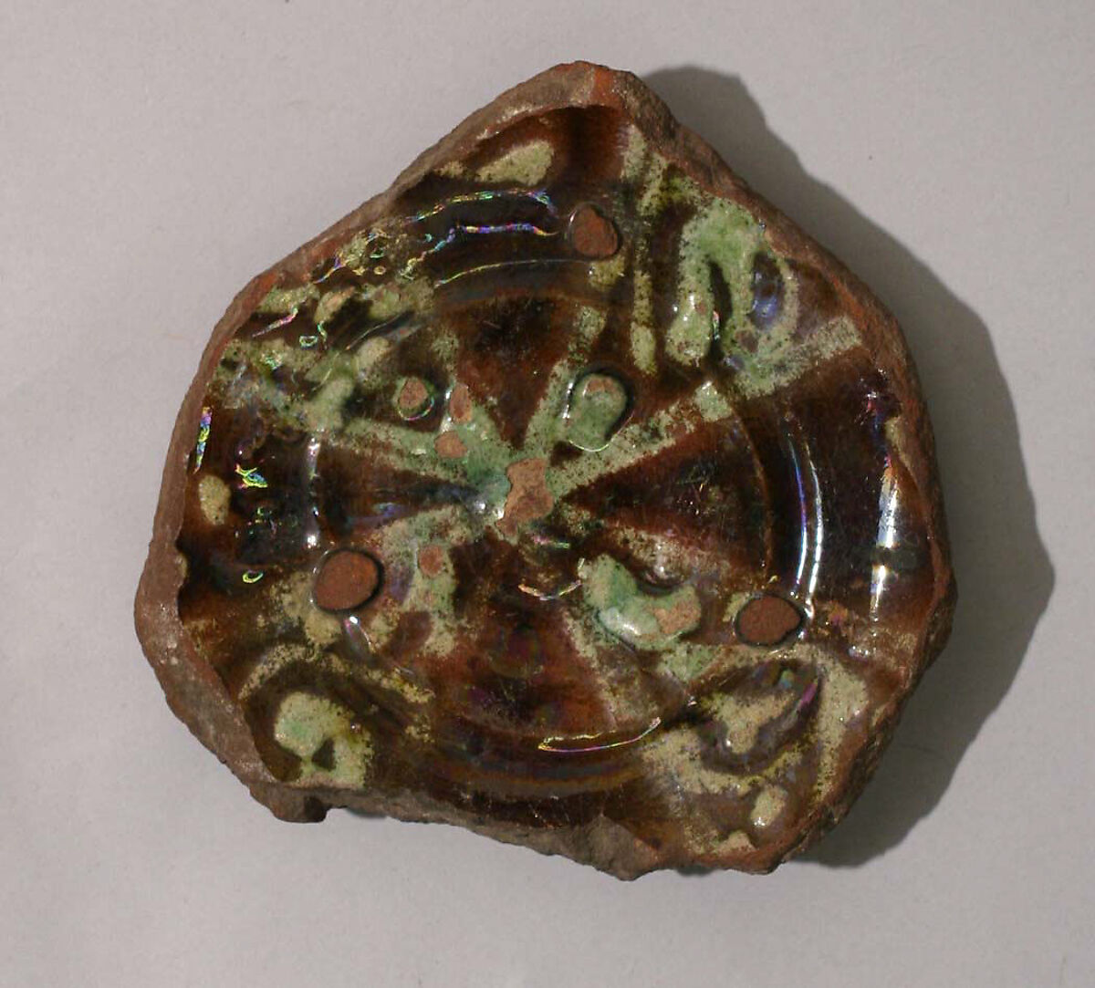 Fragment of a Bowl, Earthenware; glazed over slip 