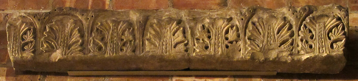 Fragment from a Molding with Acanthus Clusters under Arcades, Limestone; carved in relief