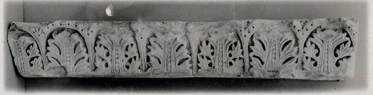 Fragment from a Molding with Acanthus Clusters under Arcades, Limestone; carved in relief 
