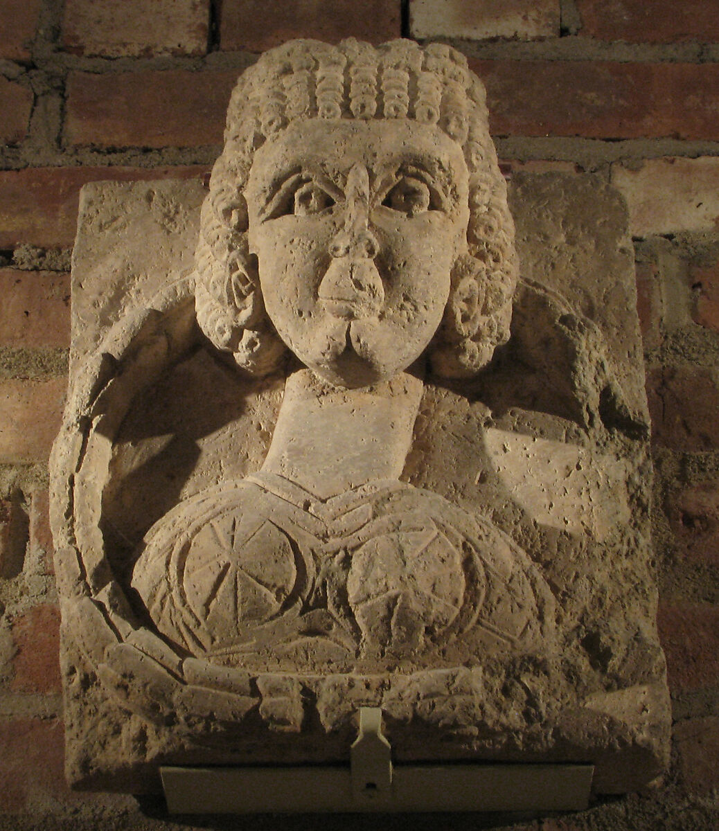 Fragment from a Relief with the Bust of a Woman, Limestone; carved
