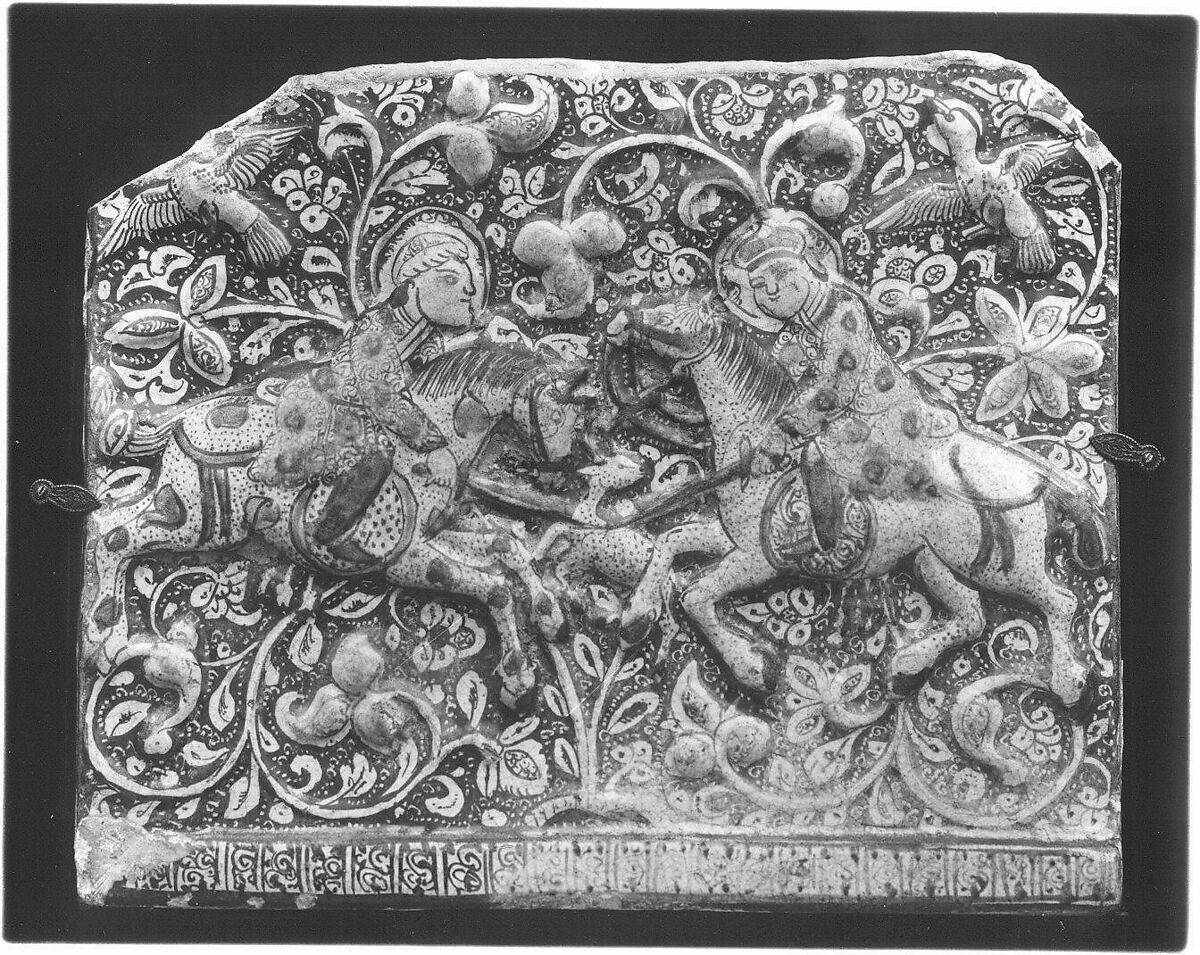 Frieze Tile with Two Hunters, Stonepaste; molded, inglaze painted in blue and turquoise, luster-painted on opaque white glaze