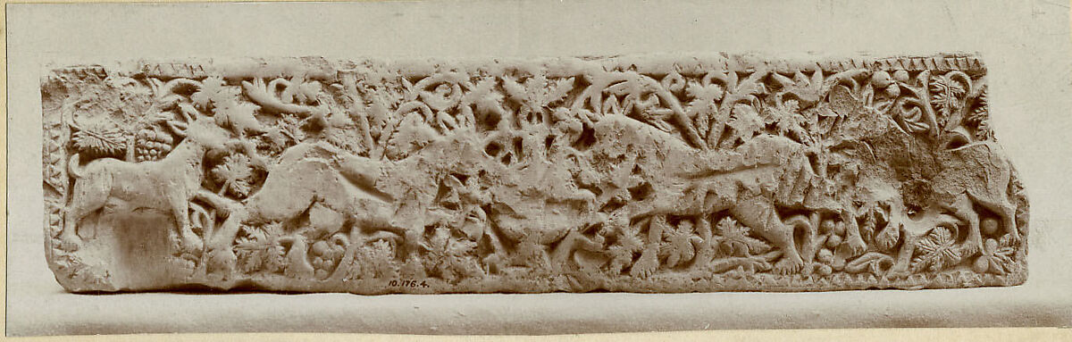 Panel with Animals Flanking a Vase Against a Pattern of Scrolls, Limestone; carved in relief
