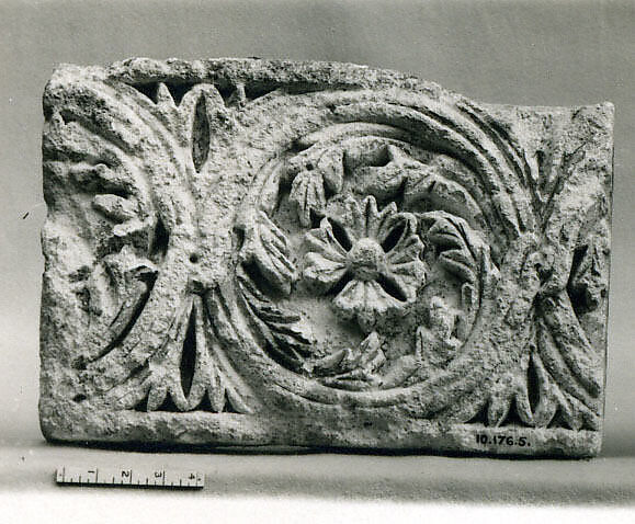Fragment of a Frieze with a Sequence of Roundels Enclosing Rosettes, Limestone; carved in relief 