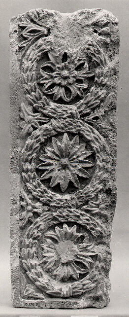 Fragment of a Frieze with a Sequence of Roundels Enclosing Rosettes, Limestone; carved in relief