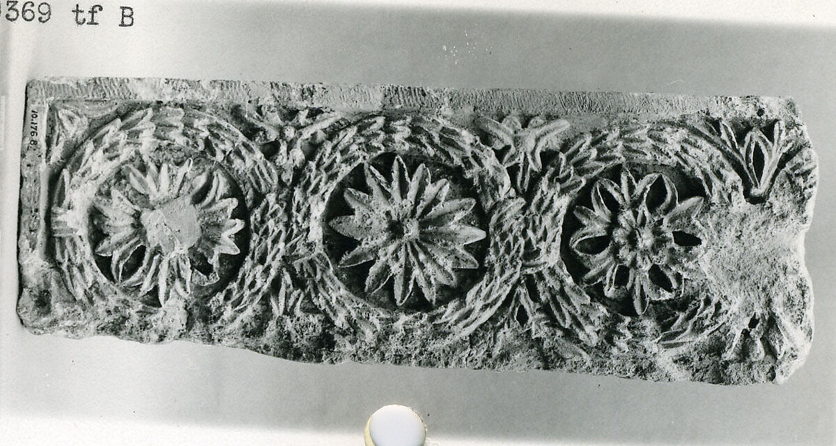 Fragment of a Frieze with a Sequence of Roundels Enclosing Rosettes, Limestone; carved in relief
