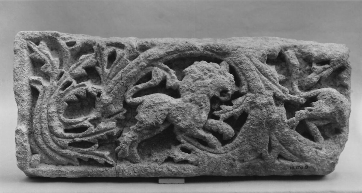 Fragment of a Frieze with Scrolls and a Lion, Limestone; carved in relief 