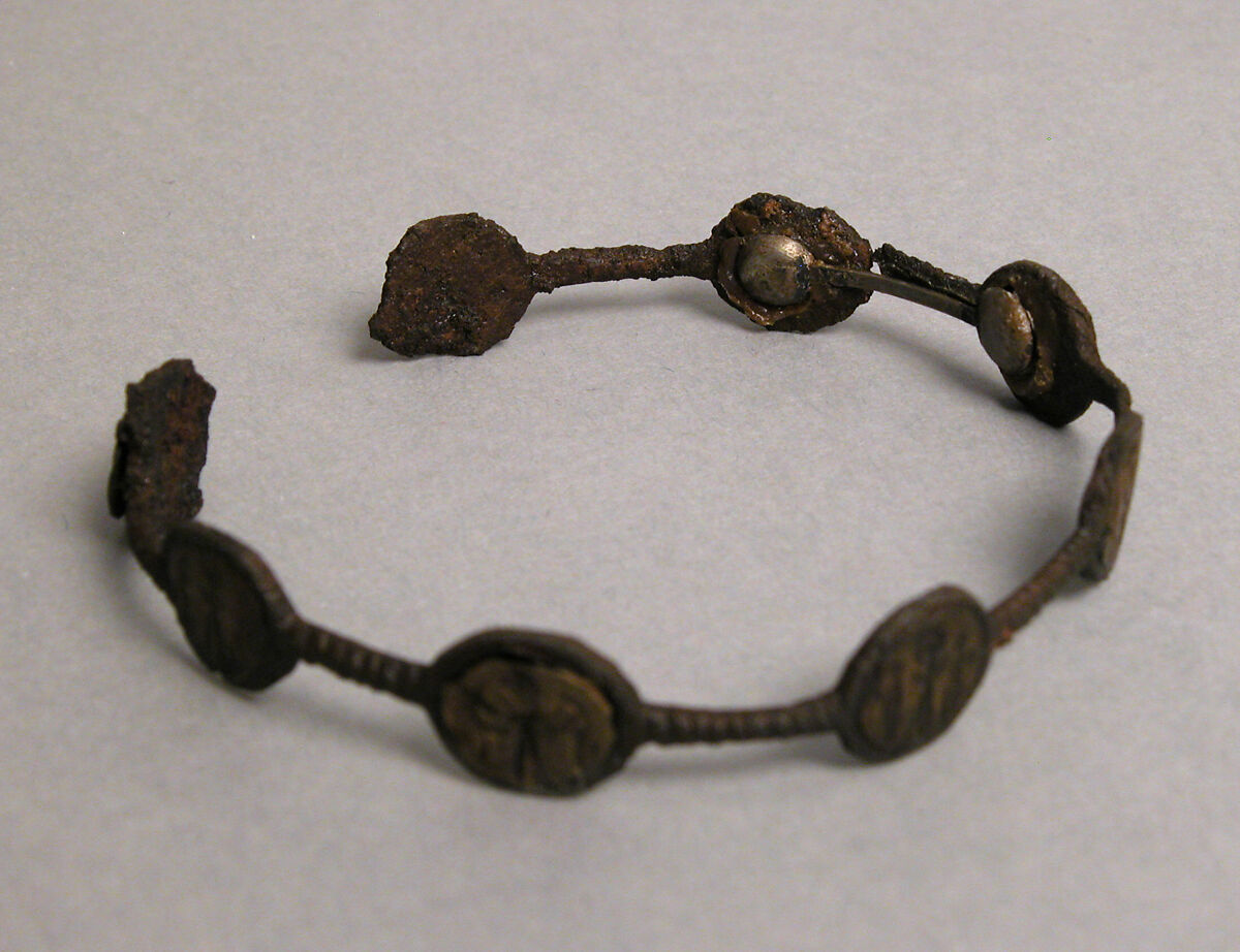 Bracelet, Iron; inlaid with bronze disks 
